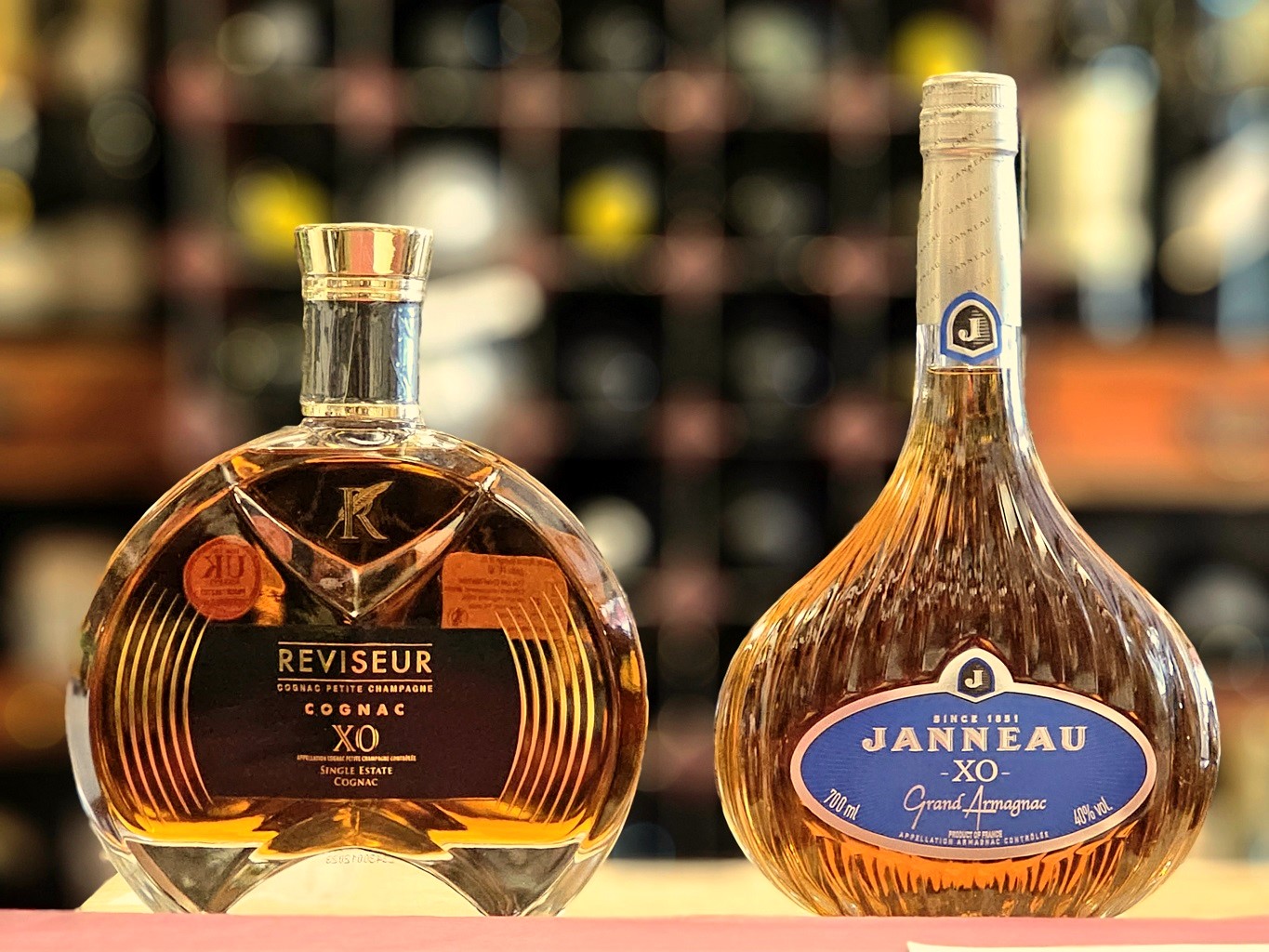 Bottles of XO Cognac and Armagnac, Le Reviseur and Janneau